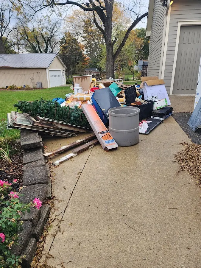 Dumpster being loaded with debris for 30 Yard Dumpster Rental in Montebello